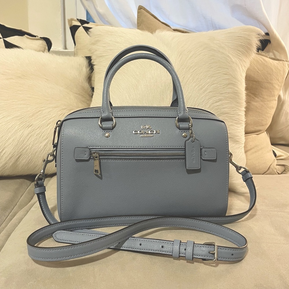 Blue cross-body Coach purse